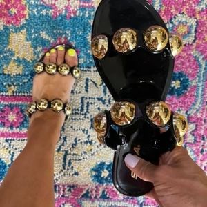 Black Sandals with Gold Sphere details on the straps. Soda Brand. Size 6